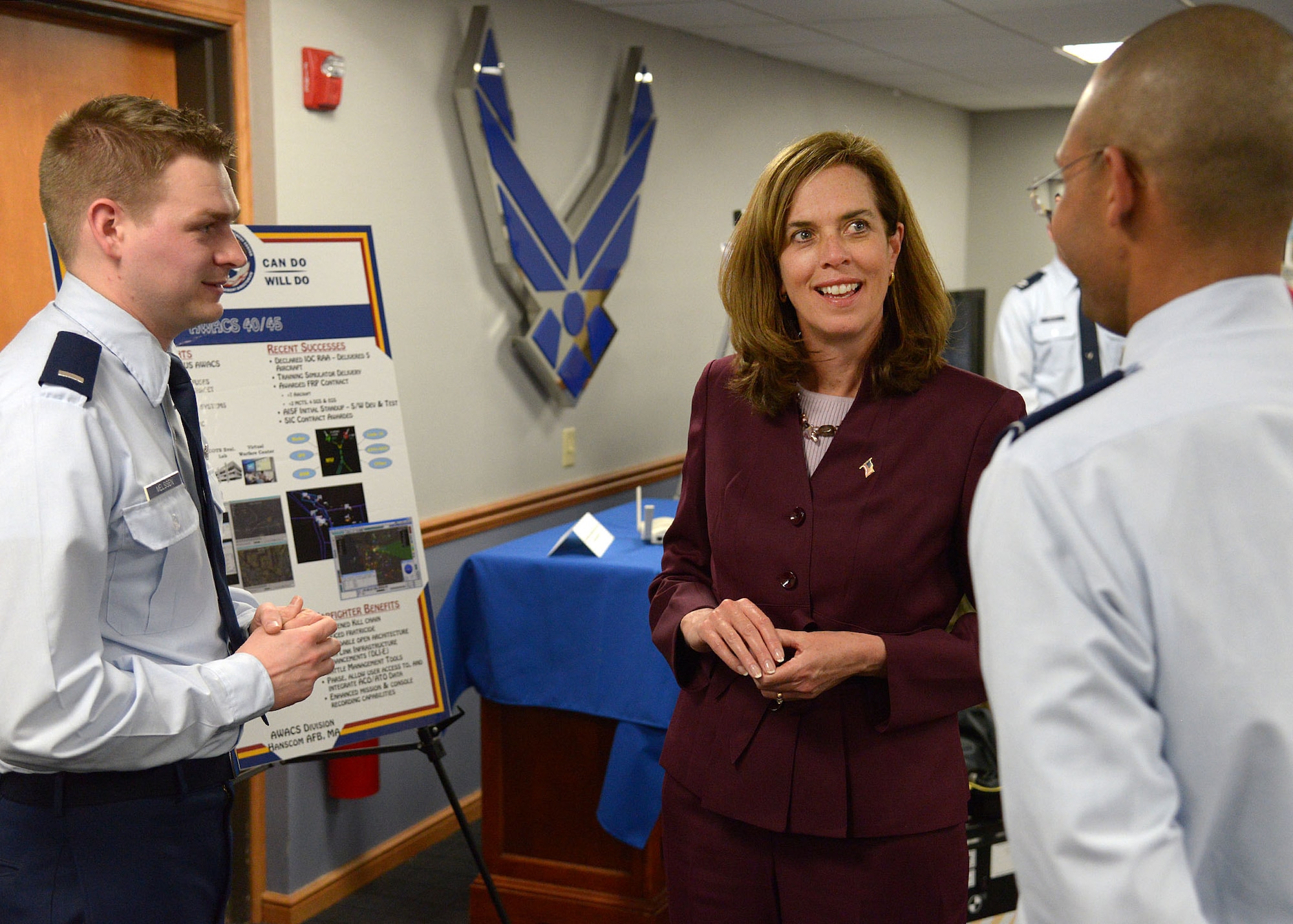 HANSCOM AIR FORCE BASE, Mass. -- U.S. Representative Katherine Clark listens to Lt. Col. Franklin Gaillard, Netcentric Capabilities Branch chief, and 1st Lt. Adam M. Melssen, Battle Management Directorate AWACS Block 40/45 project manager, during her visit here Feb. 24. Clark learned about the important work being done at Hanscom and received an Air Force Life Cycle Management Center mission overview, technology demonstrations and a windshield tour of the base. (U.S. Air Force photo by Mark Wyatt)