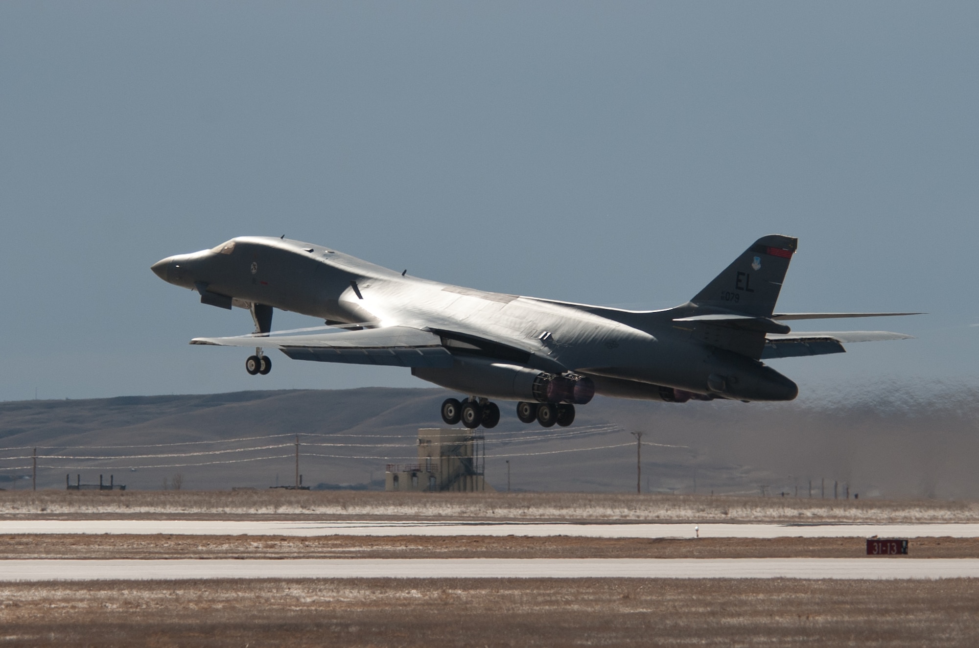 A B-1 bomber loaded with GBU-54 Laser Joint Direct Attack Munitions takes off during the Combat Hammer exercise at Ellsworth Air Force Base, S.D., Feb. 19, 2014. B-1 aircrews from the 34th Bomb Squadron employed GBU-54 LJDAMS against moving targets during the Air Force’s air to ground Weapon System Evaluation Program known as Combat Hammer, Feb. 18 to 20, which allows maintenance, munitions, weapons and aircrew Airmen the opportunity to train with these weapons. (U.S. Air Force photo by Senior Airman Alystria Maurer/Released)