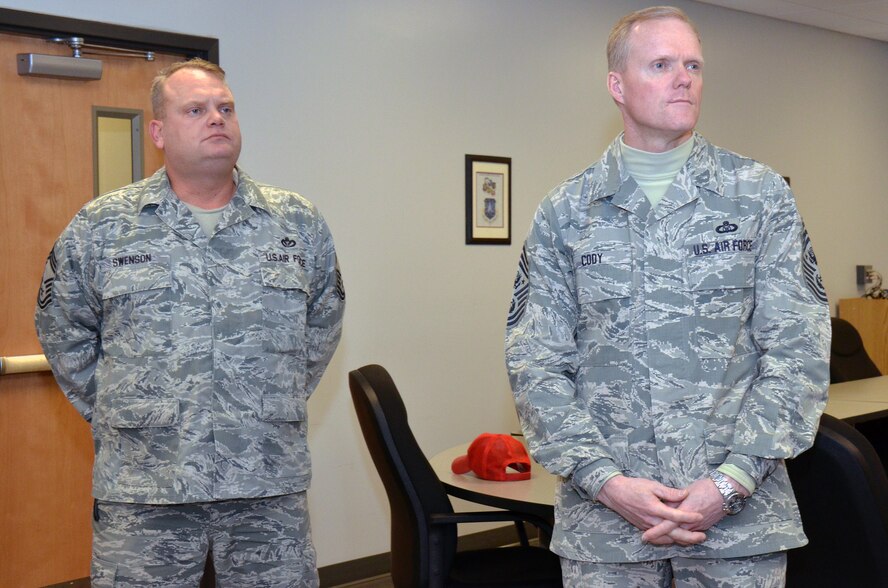 Chief Master Sgt. Paul Swenson, commandant, Regional Equipment Operators Training Site, Regional Training Site, Fort Indiantown Gap, accompanies Chief Master Sgt. of the Air Force James Cody as he is briefed on the training provided by the Lightning Force Academy at Fort Indiantown Gap, Annville, Pa., Feb. 23, 2014. Chief Cody visited the 193rd Feb. 22-23 to get a firsthand look at the wing's missions at Middletown, Pa., and Fort Indiantown Gap, Annville, Pa., and to speak with Airmen about challenges they face. (U.S. Air National Guard photo by Tech. Sgt. Ted Nichols/Released)