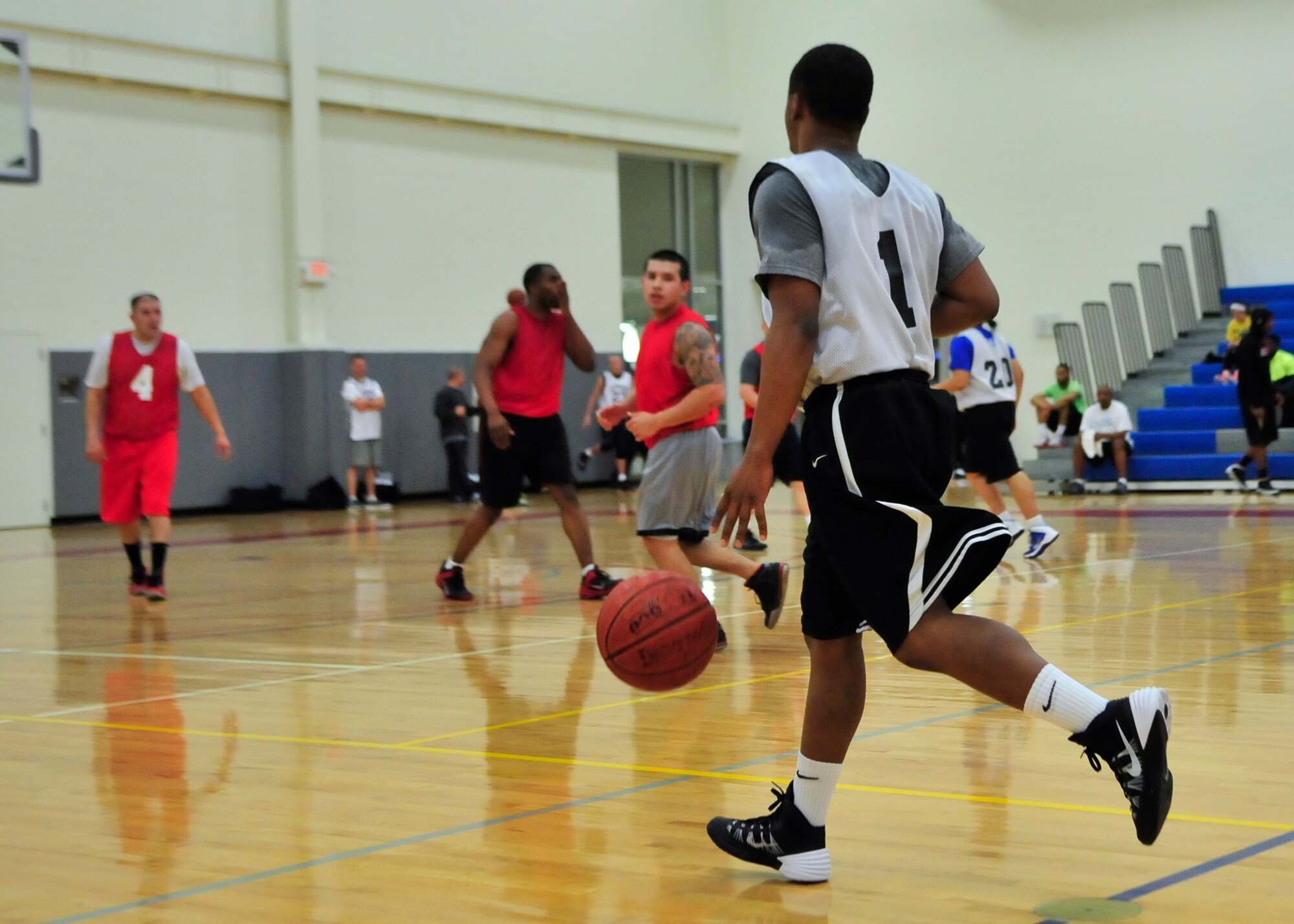 Kenny Roberts, 436th Aerial Port Squadron guard, surveys the court during an intramural basketball game against the 373d Training Squadron/Maintenance Operations Squadron Feb. 20, 2014, at the fitness center on Dover Air Force Base, Del. Roberts scored a game-high 39 points to lead the 436th APS to the 76-68 victory. (U.S. Air Force photo/Airman 1st Class William Johnson)