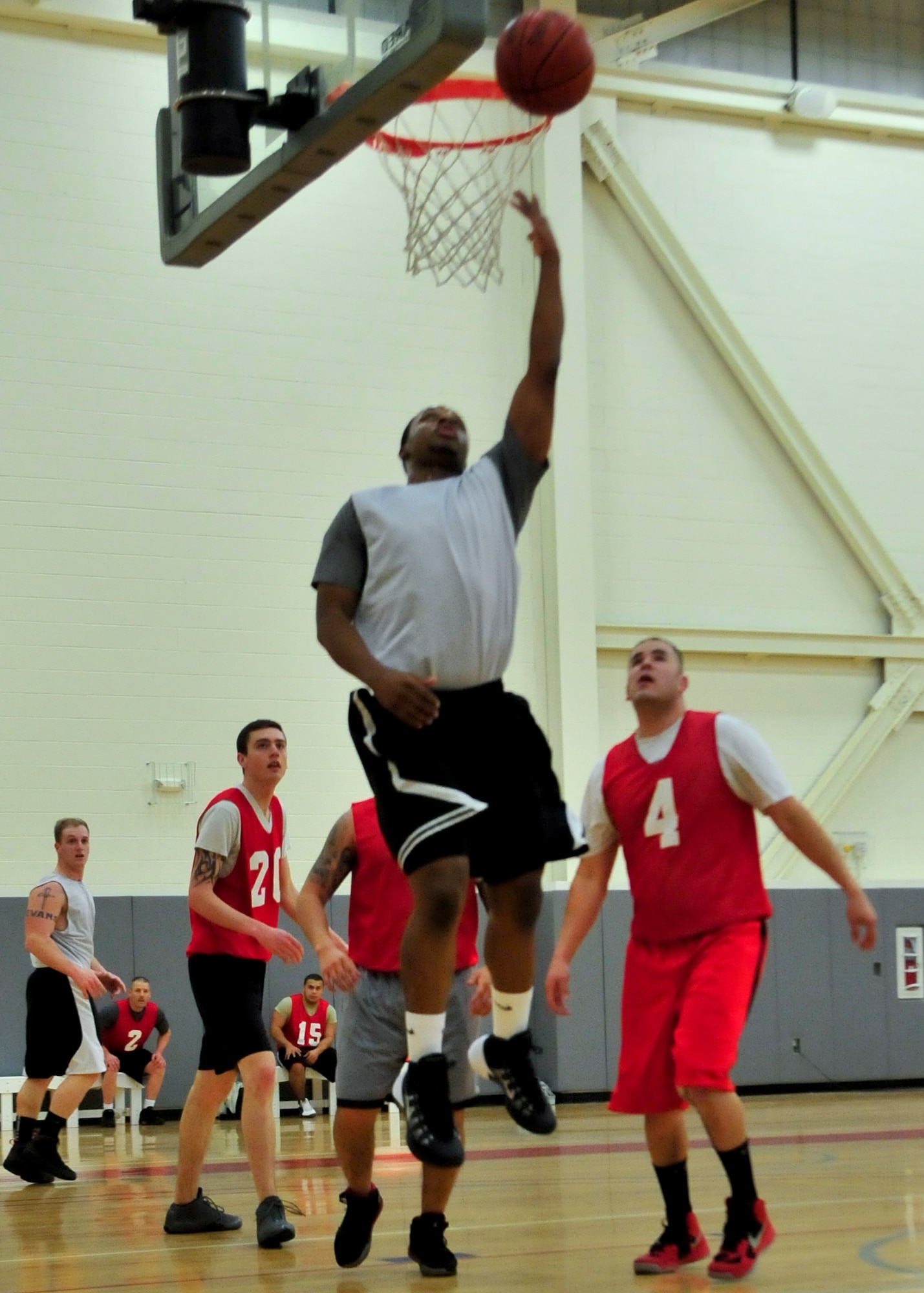 Kenny Roberts, 436th Aerial Port Squadron guard, drives for a reverse layup during an intramural basketball game Feb. 20, 2014, at the fitness center on Dover Air Force Base, Del. Roberts hit nine three pointers in the game and scored 39 points to lead the 436th APS to the 76-68 victory against the 373d Training Squadron/Maintenance Operations Squadron. (U.S. Air Force photo/Airman 1st Class William Johnson)