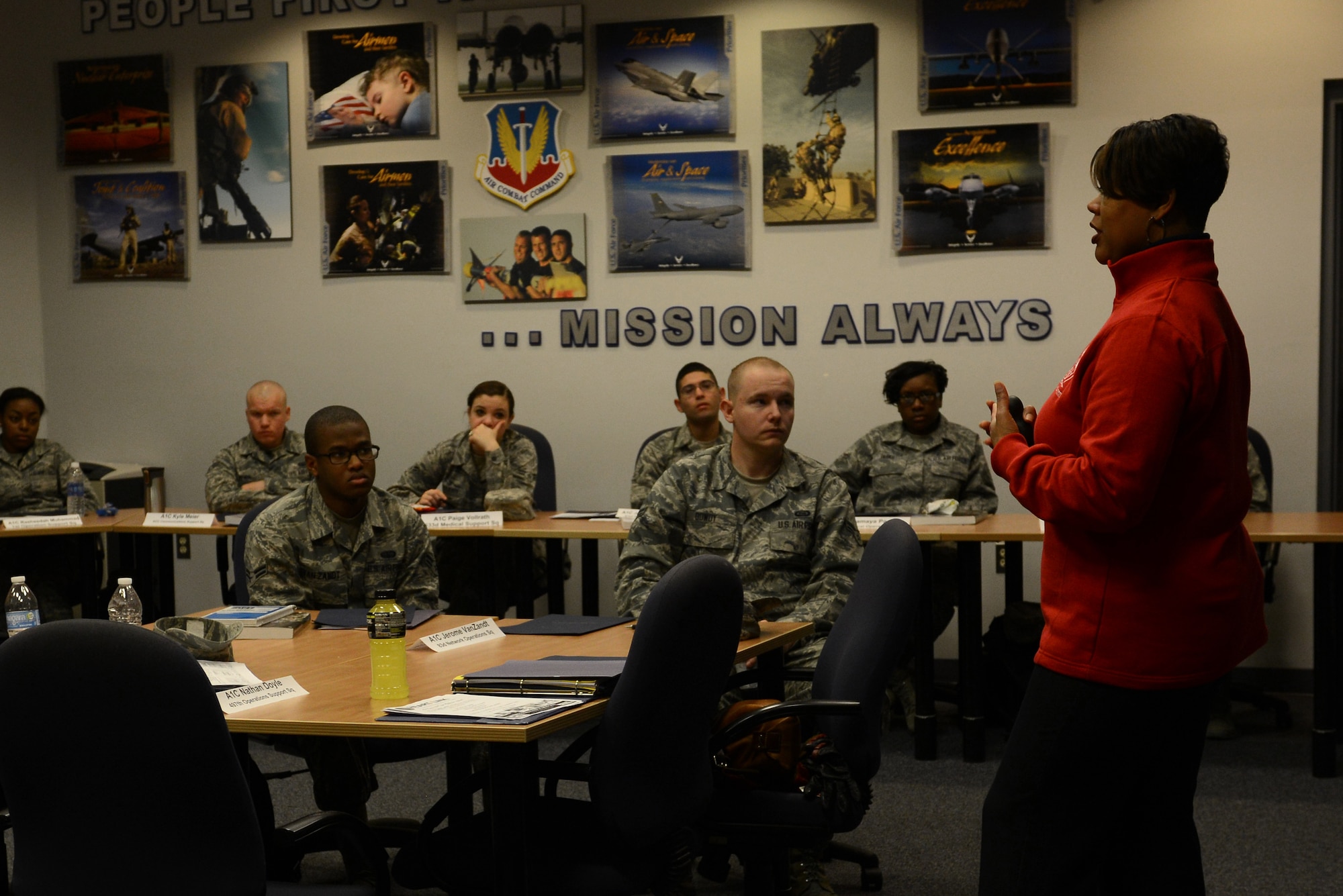 Anna Bennett, 633rd Force Support Squadron community readiness specialist, talks to Airmen during a personal finance management brief as part of the First Term Airmen Center course at Langley Air Force Base, Va., Feb. 12, 2014. During the five-day course, Airman are informed of services by different office representatives, including a financial manager and Airmen Committed to Excellence. Bennett hails from Dover, Del. (U.S. Air Force photo by Airman 1st class Kimberly Nagle/Released)