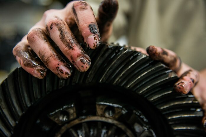 Airman 1st Class Zachary Pforr, 628th Logistics Readiness Squadron vehicle maintainer apprentice, works on a differential unit that had been disassembled to be cleaned and inspected Feb. 11, 2014, at Joint Base Charleston, S.C. Vehicle maintenance technicians maintain JB Charleston's entire vehicle fleet, keeping cars, trucks and buses operating smoothly. (U.S. Air Force photo/ Senior Airman Dennis Sloan)