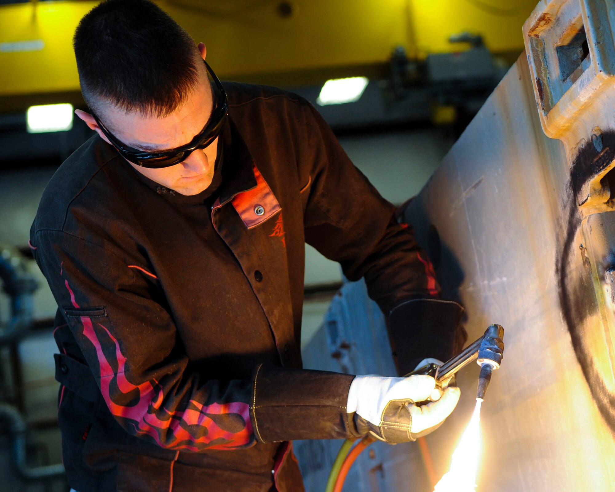 U.S. Army Spc. Andrew Phillips, 558th Transportation Company, Special Troops Battalion, 7th Transportation Brigade (Expeditionary) allied trade specialist, repairs a causeway at Fort Eustis, Va., Feb. 19, 2014. The 7th TB(X) utilizes internal methods for repair work, which saves the Army money. (U.S. Air Force photo by Senior Airman Austin Harvill/Released)
