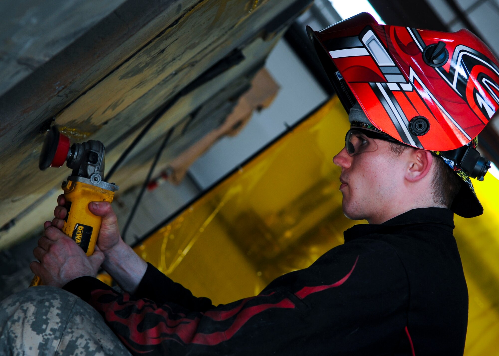 U.S. Army Pfc.  Brandon Ohlenmacher, 558th Transportation Company, Special Troops Battalion, 7th Transportation Brigade (Expeditionary) allied trade specialist, repairs a causeway at Fort Eustis, Va., Feb. 19, 2014. The 558th Trans. Co. used equipment from other battalions within the 7th TB(X). (U.S. Air Force photo by Senior Airman Austin Harvill/Released)