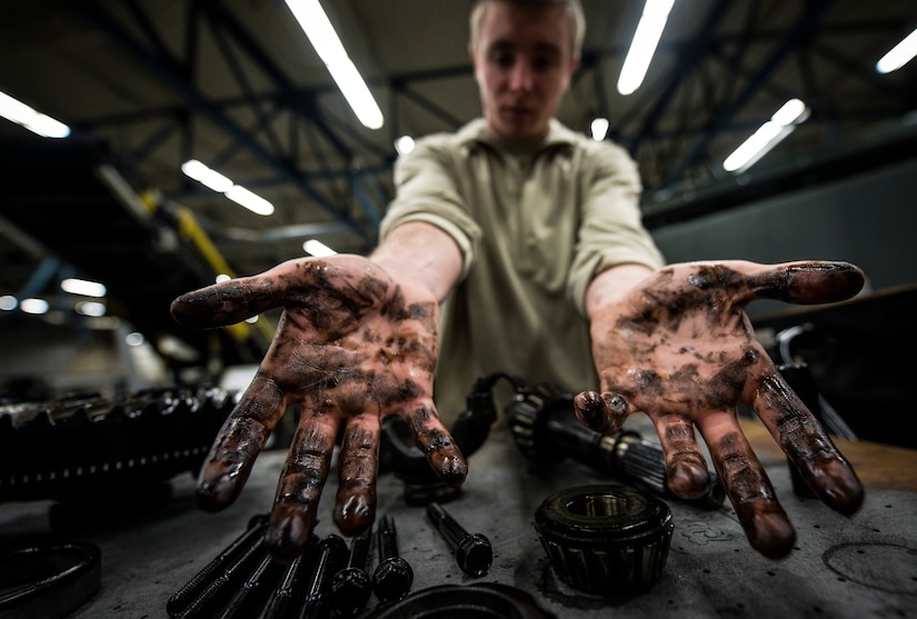 Airman 1st Class Zachary Pforr, 628th Logistics Readiness Squadron vehicle maintainer apprentice, works on a differential unit that had been disassembled to be cleaned and inspected Feb. 11, 2014, at Joint Base Charleston, S.C. Vehicle maintenance technicians maintain JB Charleston's entire vehicle fleet, keeping cars, trucks and buses operating smoothly. (U.S. Air Force photo/ Senior Airman Dennis Sloan)