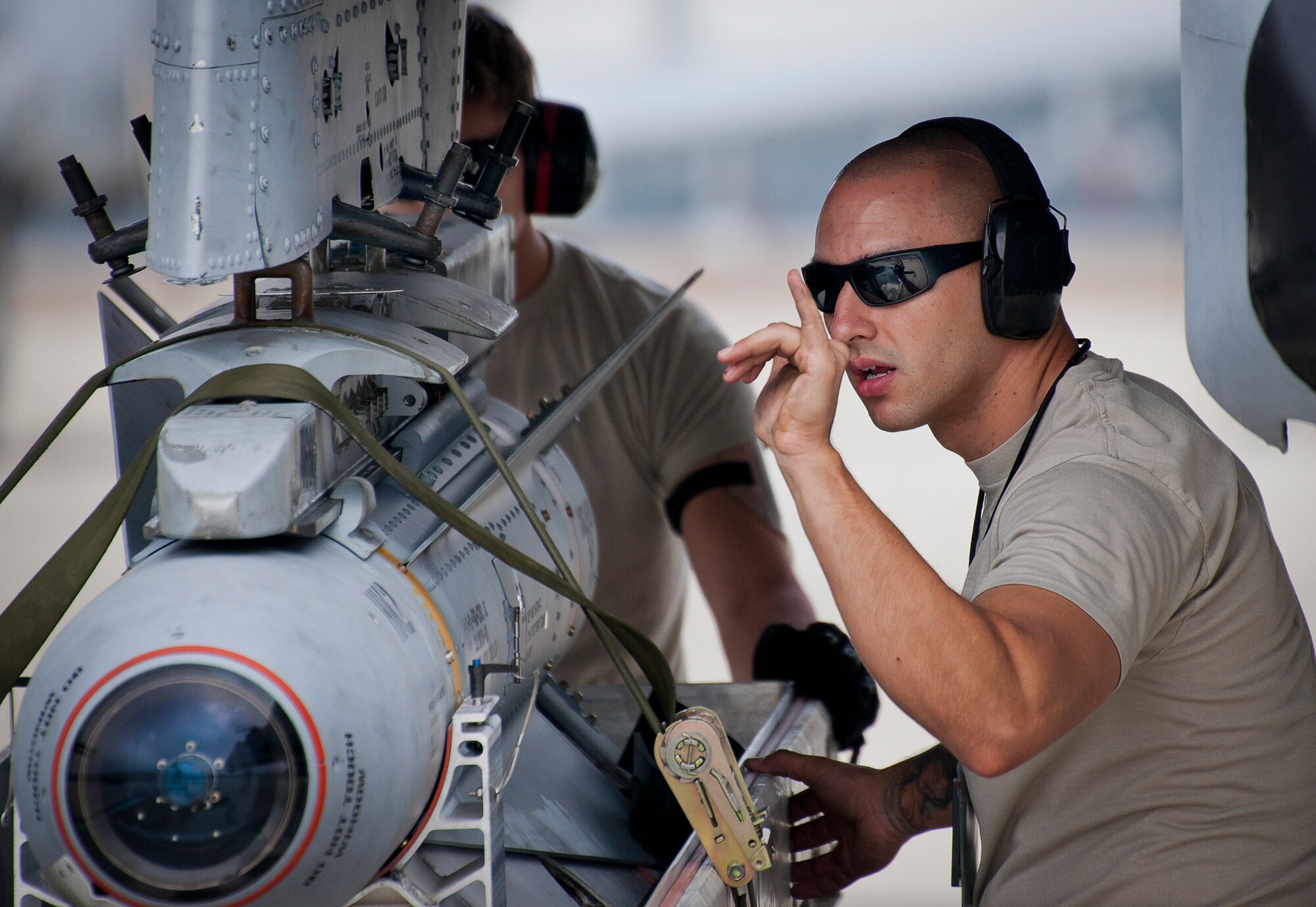 Staff Sgt. Chris Martinez, of the 355th Aircraft Maintenance Squadron, directs a jammer driver which way to turn to line up an AGM-65 prior to a sortie at Eglin Air Force Base, Fla., Feb. 19.  The A-10s from Davis-Monthan Air Force Base, Ariz., participated in the week-long mission known as Combat Hammer, in which they released air-to-ground munitions.  The Combat Hammer WSEP program is managed by the 86th Fighter Weapons Squadron, part of the 53rd Wing.  (U.S. Air Force photo/Samuel King Jr.)