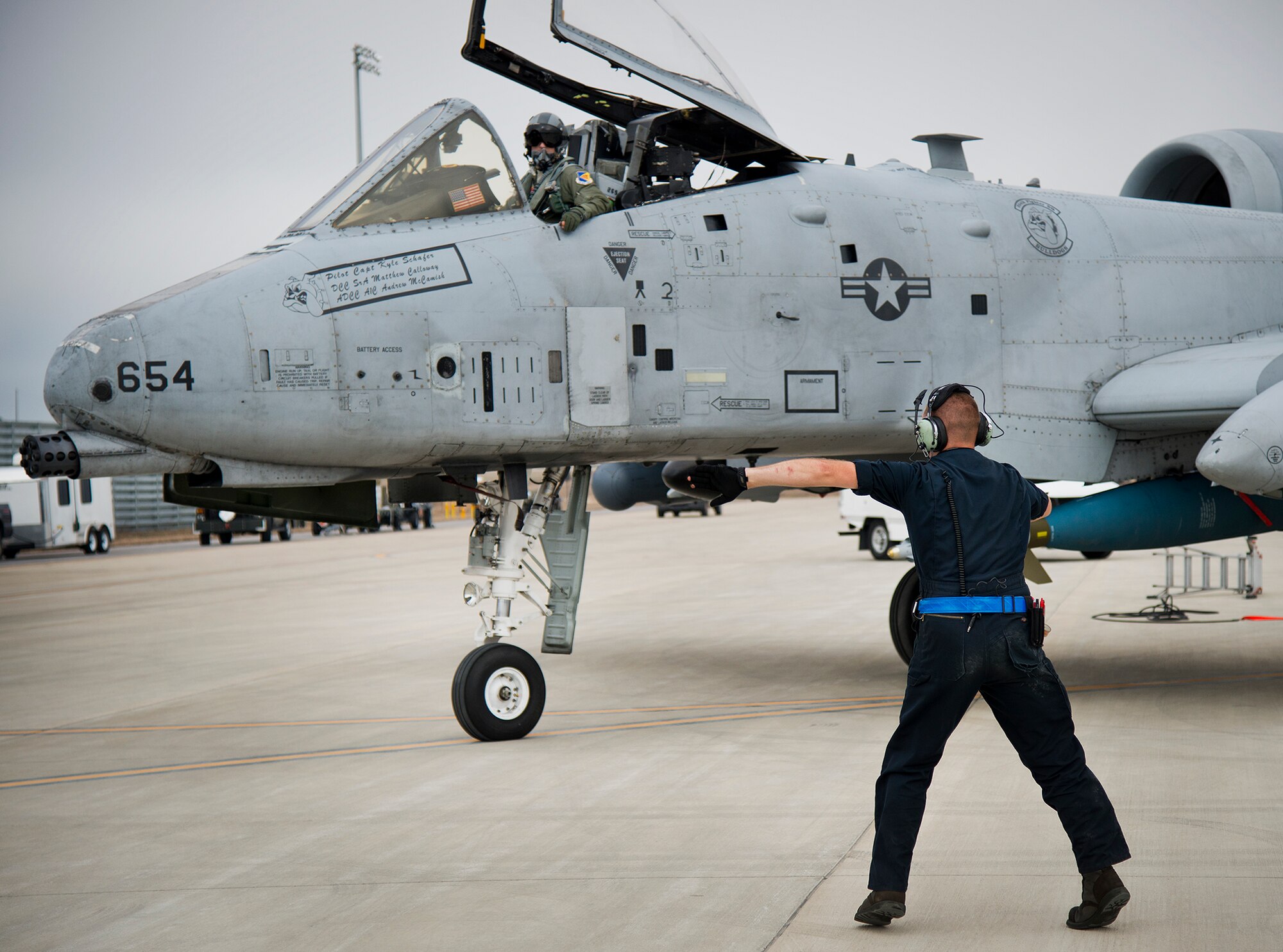 Senior Airman Matthew Calloway, of the 355th Aircraft Maintenance Squadron, marshals out his A-10 Thunderbolt II for a Weapon System Evaluation Program sortie at Eglin Air Force Base, Fla., Feb. 19.  The A-10s from Davis-Monthan Air Force Base, Ariz., participated in the week-long mission known as Combat Hammer, in which they released air-to-ground munitions.  The Combat Hammer WSEP program is managed by the 86th Fighter Weapons Squadron, part of the 53rd Wing.  (U.S. Air Force photo/Samuel King Jr.)