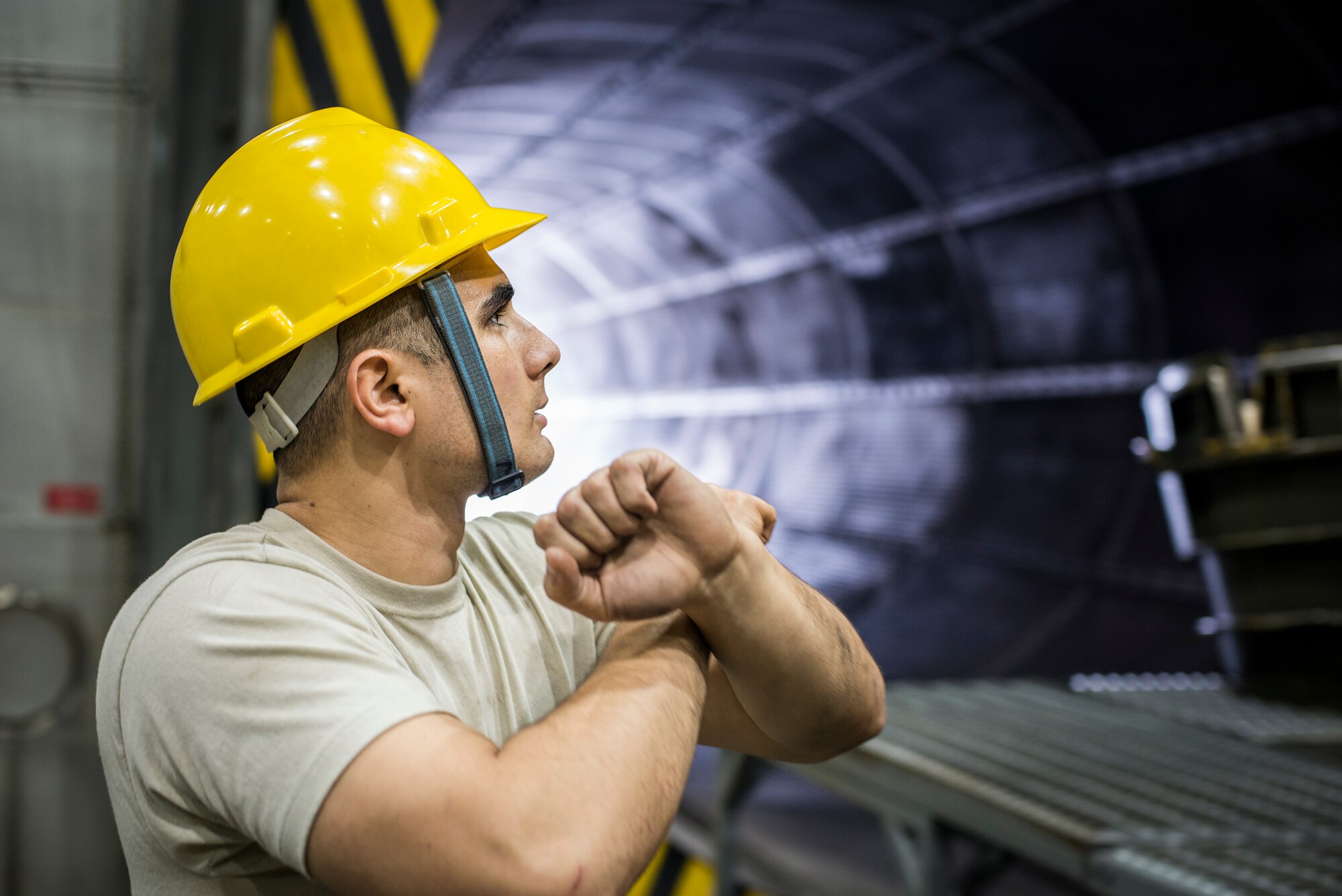 U.S. Air Force Senior Airman Anthony Cruz, 23d Component Maintenance Squadron aerospace propulsion journeyman, directs a crane operator during preparations for an engine run at Moody Air Force Base, Ga., Feb. 21, 2014. Moody’s test cell runs two to three engines per month. (U.S. Air Force photo by Airman 1st Class Ryan Callaghan/Released)