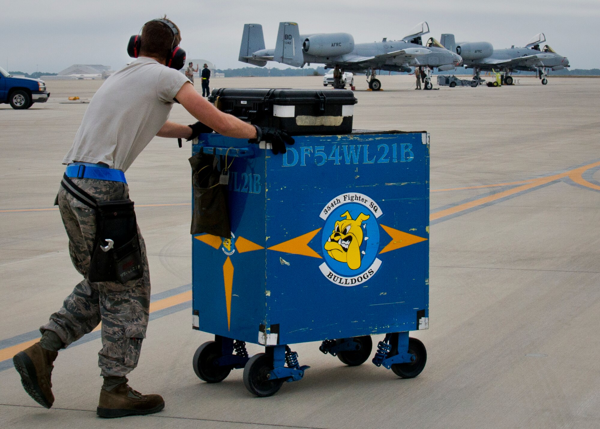 A 355th Aircraft Maintenance Squadron maintainer moves his tool box after his aircraft had taxied for a sortie at Eglin Air Force Base, Fla., Feb. 19. The A-10s from Davis-Monthan Air Force Base, Ariz., participated in the week-long Weapon System Evaluation Program known as Combat Hammer, in which they released air-to-ground munitions.  The Combat Hammer WSEP program is managed by the 86th Fighter Weapons Squadron, part of the 53rd Wing.  (U.S. Air Force photo/Samuel King Jr.)