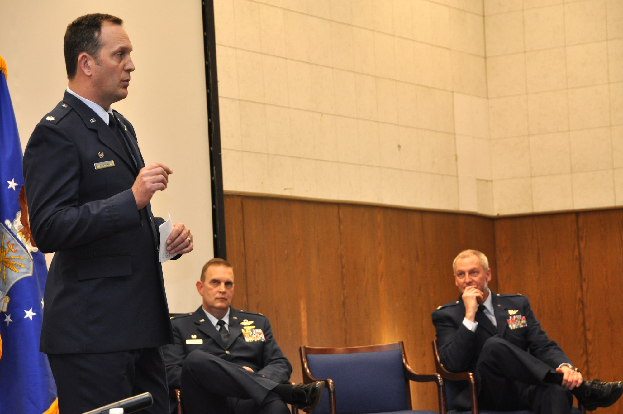 Air Force Lt. Col. Michael Moeding discusses his plans as new commander of the 459th Operations Group, during a change of command ceremony held in the 459th Air Refueling Wing auditorium, Feb. 22, 2014. Col. William Mason, 459 ARW commander, presided over the ceremony for Moeding and Col. Brian Davis, departing 459 OPS commander. (U.S. Air Force photo by/ Staff Sgt. Amber J. Russell)