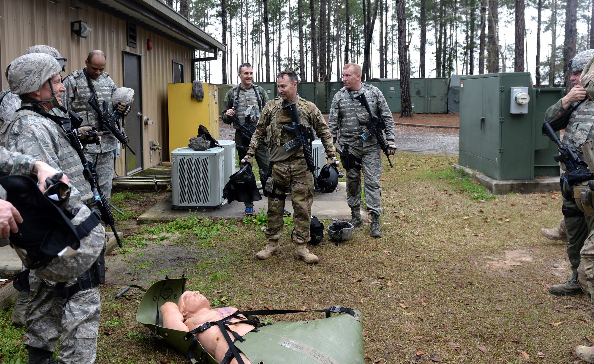 The 23d Wing leadership recap after completing a rescue mission at the military operations in urban terrain village at Moody Air Force Base, Ga., Feb. 21, 2014. The commanders completed a rescue mission while being attacked by members of the 38th Rescue Squadron and 23d Security Forces Squadron to test what they learned throughout the day. (U.S. Air Force photo by Senior Airman Olivia Bumpers/Released)