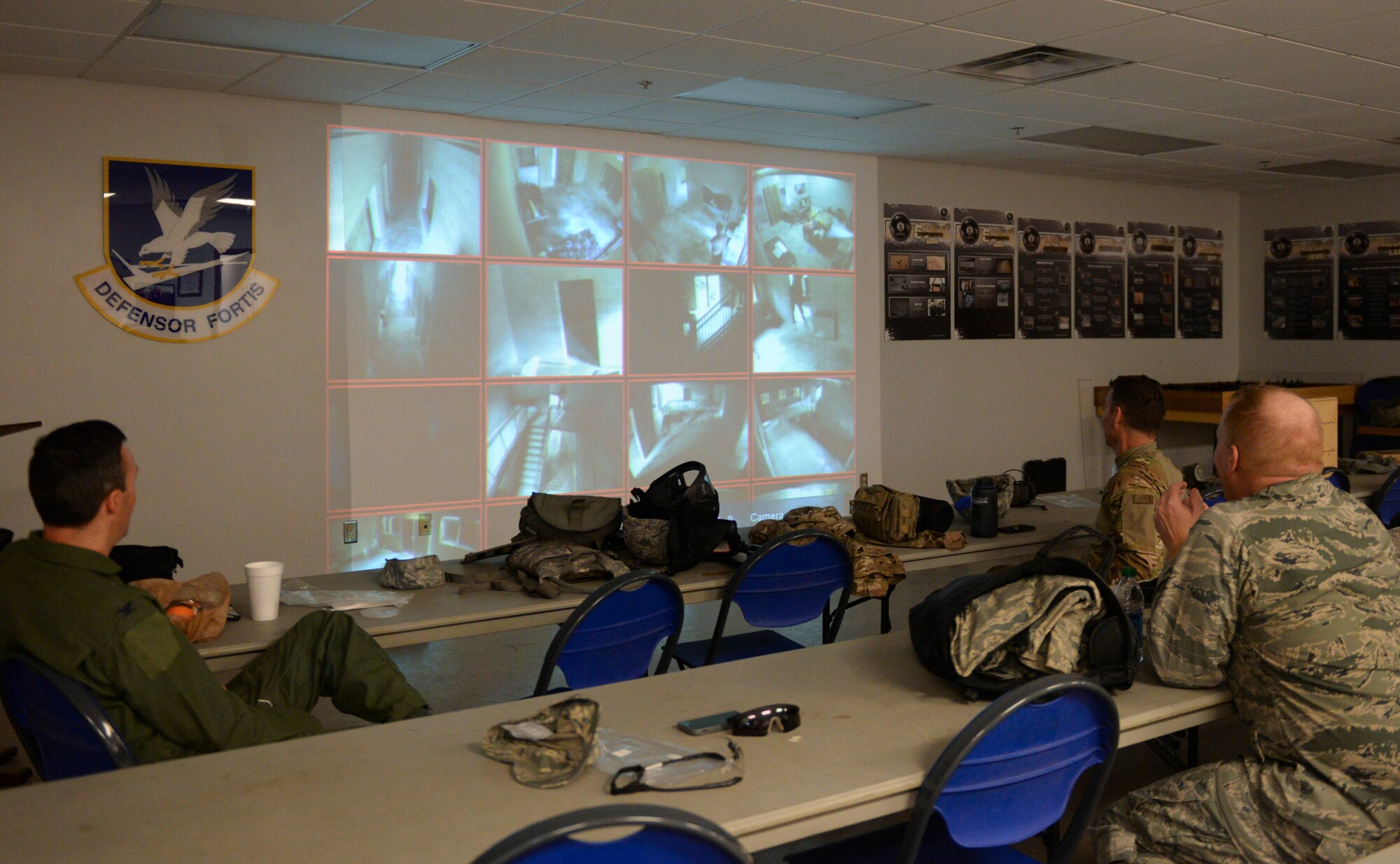(From left) U.S. Air Force Col. Steven Gregg, 347th Rescue Group commander, Col. Chad Franks, 23d Wing commander, and Col. Steven Ramer, 23d WG vice commander, watch Team B complete a rescue mission at Moody Air Force Base, Ga., Feb. 21, 2014. The 23d WG leadership split up into two groups and watched each other complete a hostage situation. (US. Air Force photo by Senior Airman Olivia Bumpers/Released)