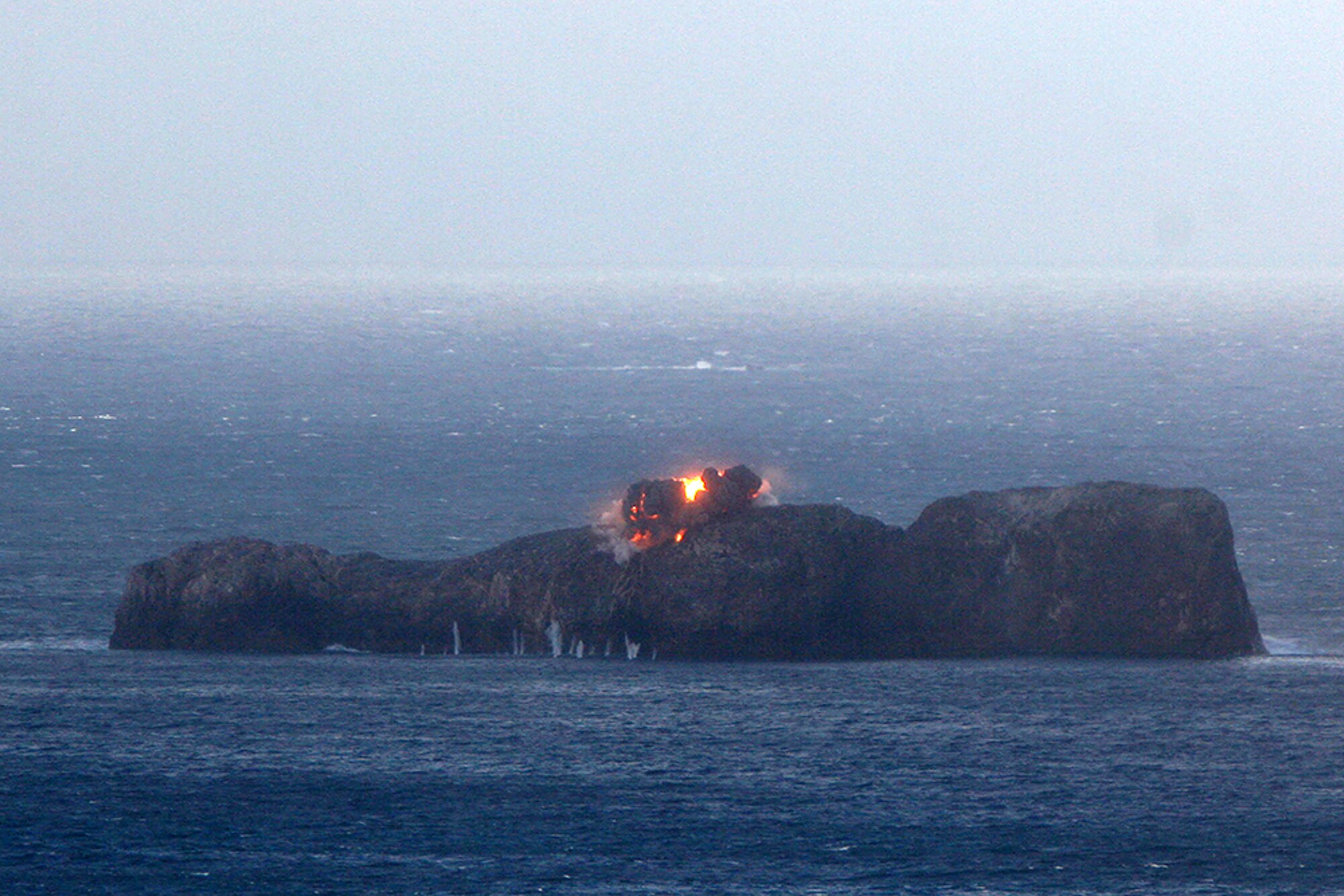 A GBU-12 explodes on a small island off of Cape Wrath, Scotland, Feb. 10, 2014. F-15E Strike Eagles from the 492nd Fighter Squadron dropped 48 live GBU-12s off the coast of Scotland, as part of a pre-deployment exercise. (Courtesy photo)  