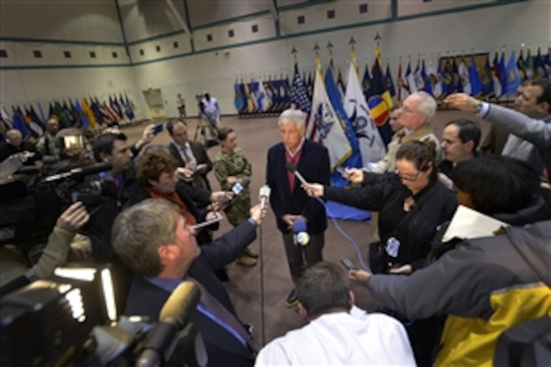 Defense Secretary Chuck Hagel talks to reporters after visiting troops on Fort Eustis, Va., Feb. 25, 2014.  Hagel, who also visited nearby Langley Air Force Base, is on a three-day trip during which he will participate in NATO meetings for defense ministers in Brussels.