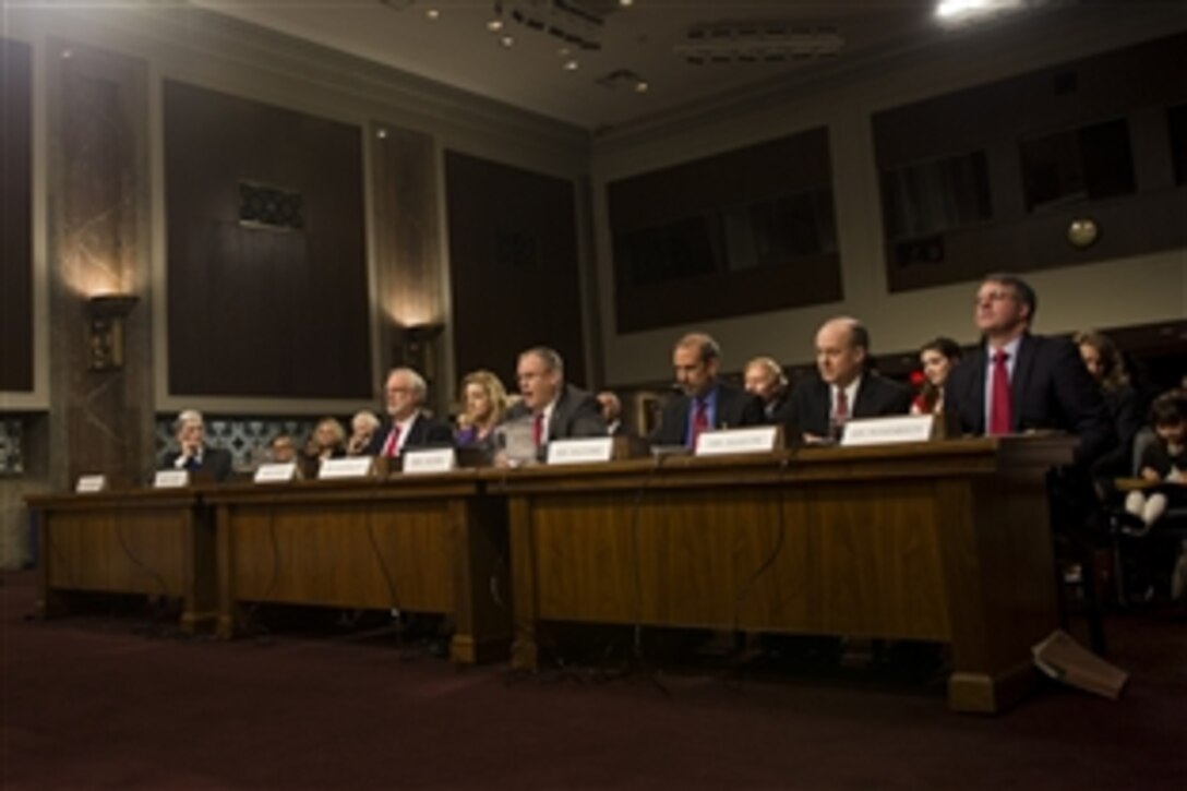 Robert O. Work, center, the nominee for deputy defense secretary, testifies during a nomination hearing for him and other Defense Department nominees before the Senate Armed Services Committee in Washington, D.C., Feb. 25, 2014.