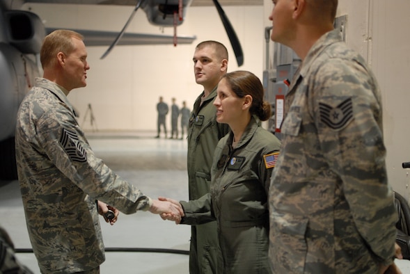 Chief Master Sgt. of the Air Force James A. Cody presents a coin to Tech. Sgt. Donielle Stewart, 193rd Special Operations Wing EC operator, for outstanding service. Chief Cody visited the 193rd Feb. 22-23 to get a firsthand look at the wing’s Commando Solo mission and speak with Airmen about challenges they face. (U.S. Air National Guard photo/Senior Airman Claire Behney)