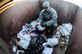 Tech. Sgt. Christopher Mosley searches for operations security and personally identifiable information violations Jan. 28, 2014, Eielson Air Force Base, Alaska. During Operational Readiness Exercises, units are evaluated on OPSEC to ensure Airmen properly dispose critical information. Mosley is the 354th Fighter Wing Plans and Programs NCO in charge. (U.S. Air Force photo/Senior Airman Zachary Perras)