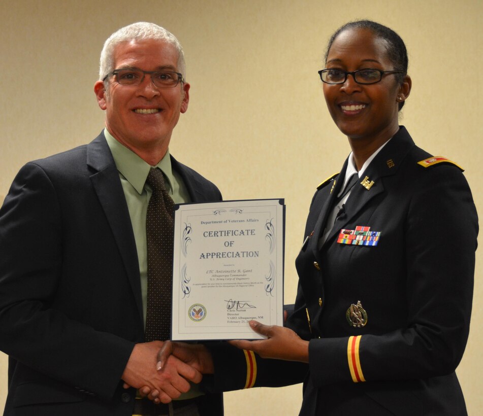 ALBUQUERQUE, N.M., -- District Commander Lt. Col. Gant spoke at the Veterans Affairs Regional Office Friday, Feb. 21, in honor of African American Month. She is shown here receiving a Certificate of Appreciation from Mr. Chris Norton, Chief, VARO, for sharing her thoughts on African-American Heritage.  