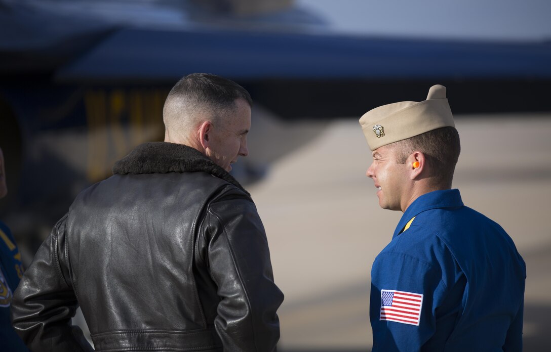 Col. John P. Farnam, Marine Corps Air Station Miramar commanding officer, speaks with Navy Lt. Ryan Chamberlain, Blue Angels' VIP events coordinator, aboard MCAS Miramar, Calif., Feb. 26. The Blue Angels plan on making an appearance for the 2014 MCAS Miramar Air Show. 
