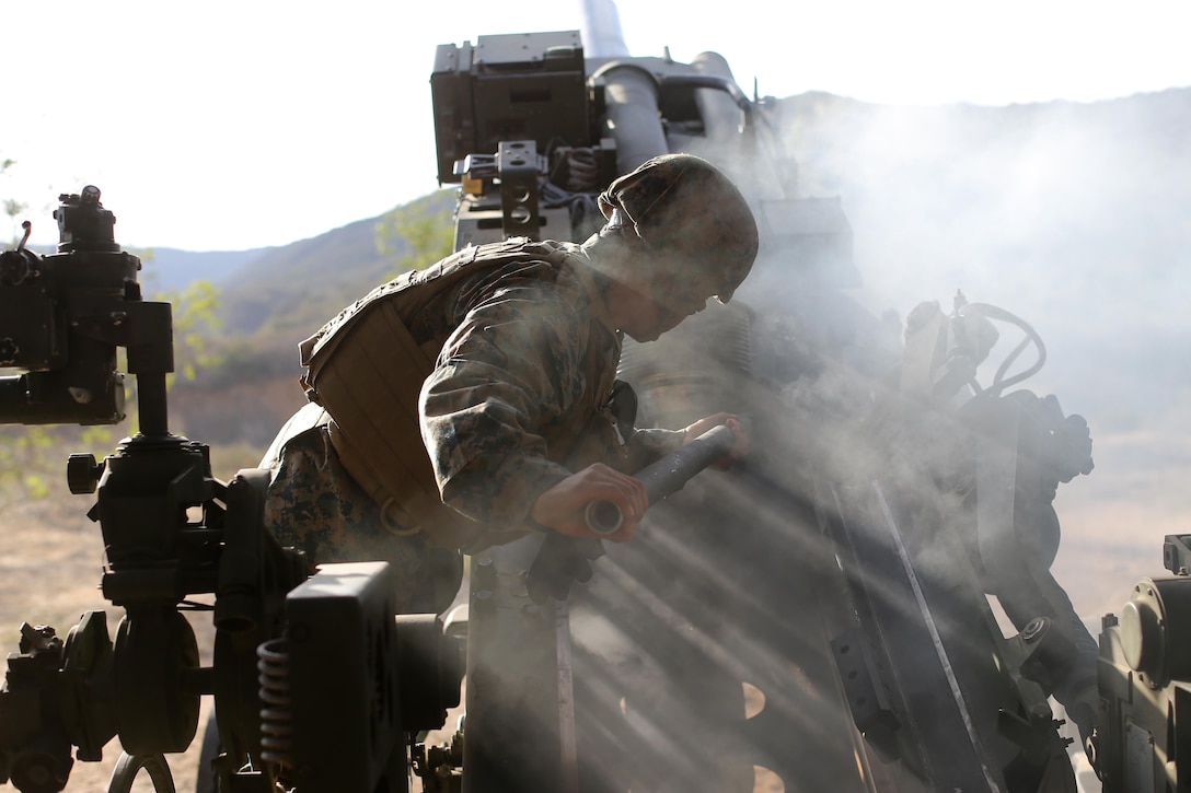 A Marine with Charlie Battery, 1st Battalion, 11th Marine Regiment, swabs the barrel of a M777 Howitzer during a qualification exercise aboard Camp Pendleton Feb. 26, 2014. The qualification exercise will prepare the Marines of 1/11 for their upcoming deployment with the 11th Marine Expeditionary Unit.