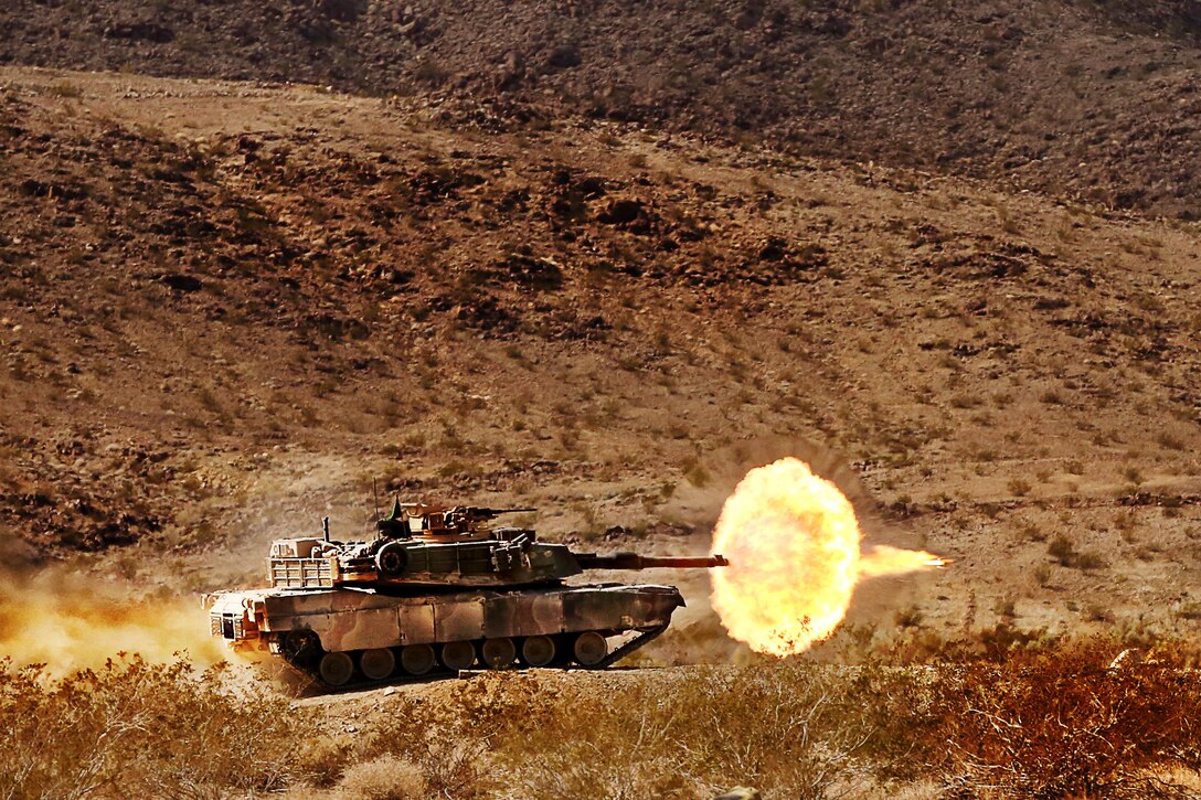 Marines with 1st Tank Battalion fire an1A1 Abrams tank during the 11th Annual Tank Gunnery Competition at Range 500, Feb. 20, 2014. The competition was divided into six segments to test the skills of the tank crewmen.


