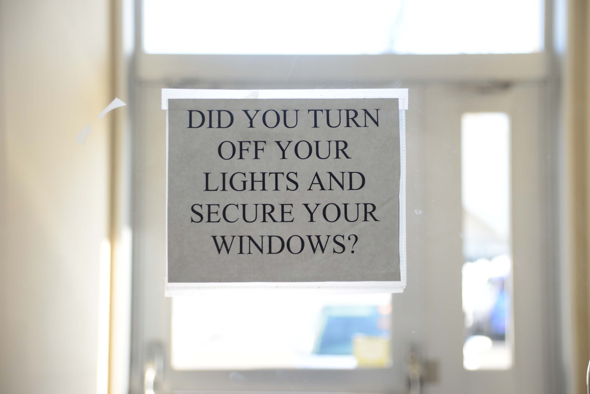 Facility managers place signs around their buildings to remind members to do their part in conserving energy on Misawa Air Base, Japan, Feb. 26, 2014. The 35th Civil Engineer Squadron resource efficiency managers developed a friendly energy reducing competition being held quarterly between five facilities from each of the groups within the 35th Fighter Wing and a Navy facility, to see who can conserve the most energy. (U.S. Air Force photo by Tech. Sgt. April Quintanilla)