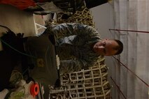 Tech. Sgt. Kevin Wulf, 644th Combat Communications Squadron cyber transport supervisor, tests the quality of transmission paths between satellite and a mobile server Jan. 13, 2014, on Andersen Air Force Base, Guam. The 644th CBCS is continuously ready to deploy anything from a small detail consisting of two Airmen and a laptop, to a package that can provide up to three bases full communications support. (U.S. Air Force photo illustration by Airman 1st Class Emily A. Bradley/Released)