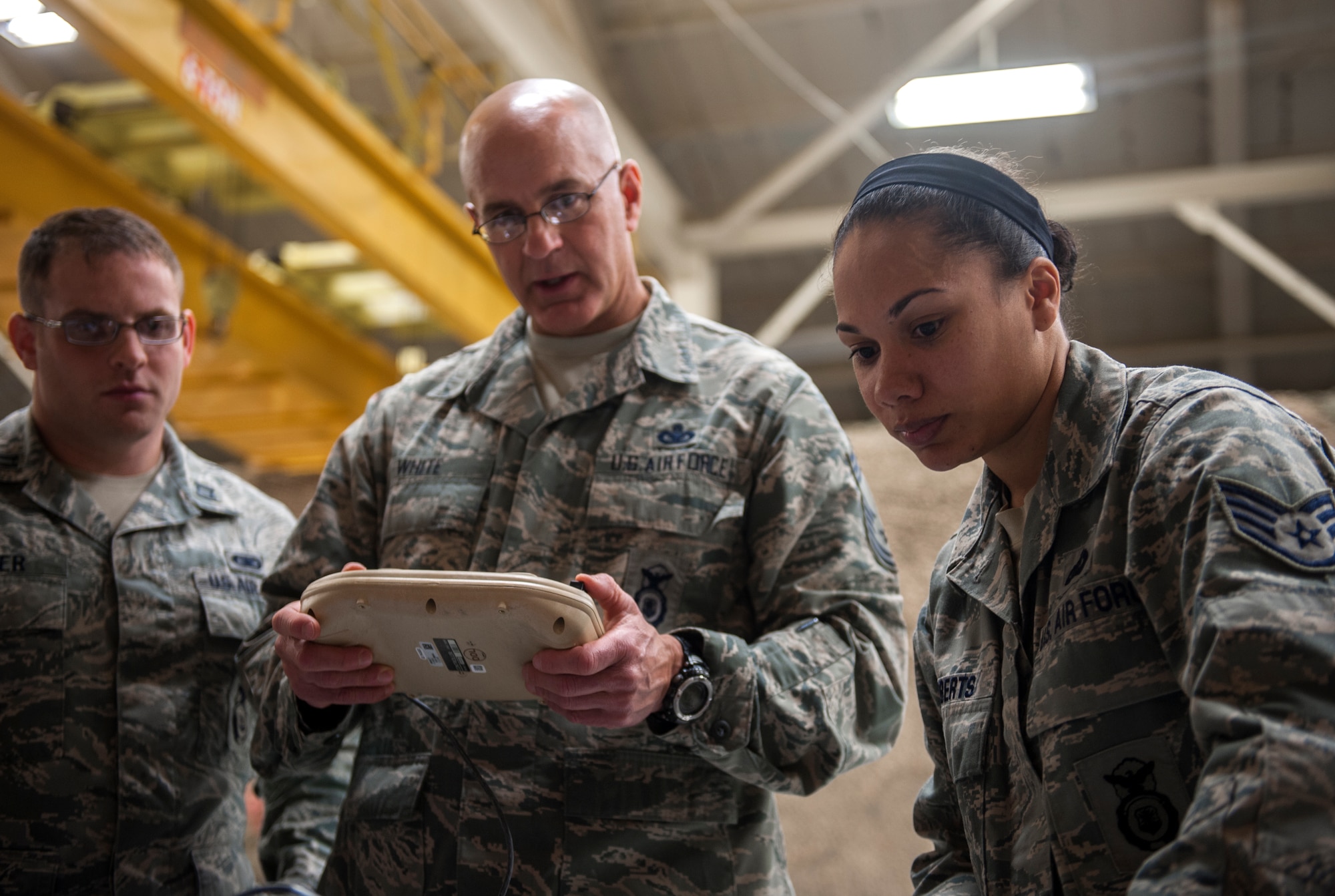 U.S. Air Force Staff Sgt. Rodshede Roberts, 820th Combat Operations Squadron technologies NCO, tells Chief Master Sgt. Stephen White, security forces career field manager for Headquarters U.S. Air Force, Washington, D.C., about the RQ-11B Raven at Moody Air Force Base, Ga., Feb. 26, 2014. White visited Moody as part of a leadership tour to observe Airmen and keep them up to date on current issues within the Air Force and security forces. (U.S. Air Force photo by Senior Airman Jarrod Grammel/Released)
