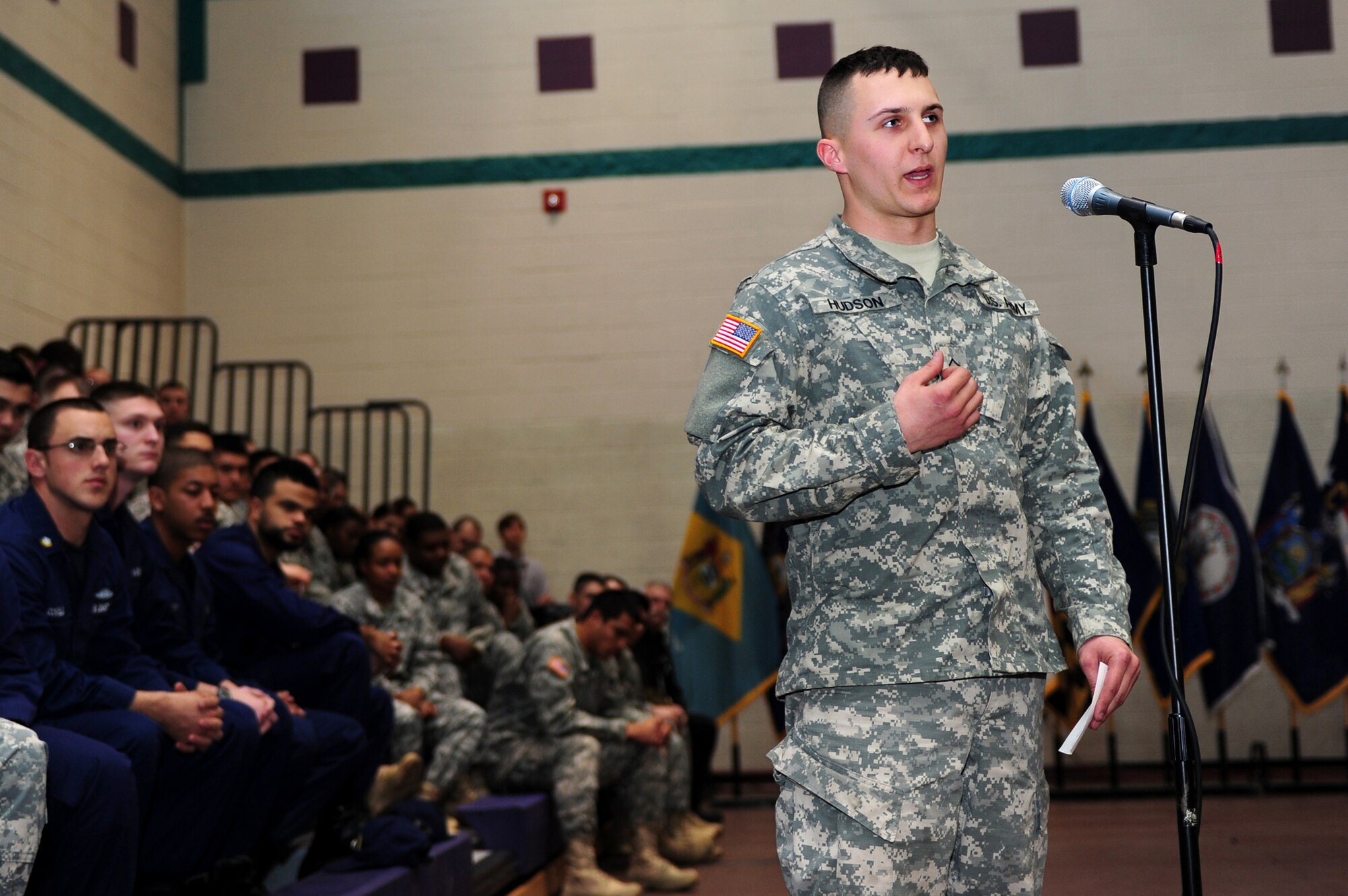 U.S. Army Pvt. George Thomas Hudson IV, 331st Transportation Company, 11th Battalion, 7th Transportation Brigade (Expeditionary) watercraft operator, asks Defense Secretary Chuck Hagel a question during a town hall at Fort Eustis, Va., Feb. 25, 2014. Hagel discussed the proposed budget for fiscal year 2015. (U.S. Air Force photo by Airman 1st Class Areca T. Wilson/Released)

