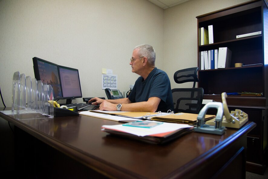 Ralph Densmore, 23d Wing Information Protection Office personnel security manager, reviews a service member’s security clearance at Moody Air Force Base, Ga., Feb. 20, 2014. Densmore specializes in working with Moody Leadership on security concerns. (U.S. Air Force photo by Airman Dillian Bamman/Released)