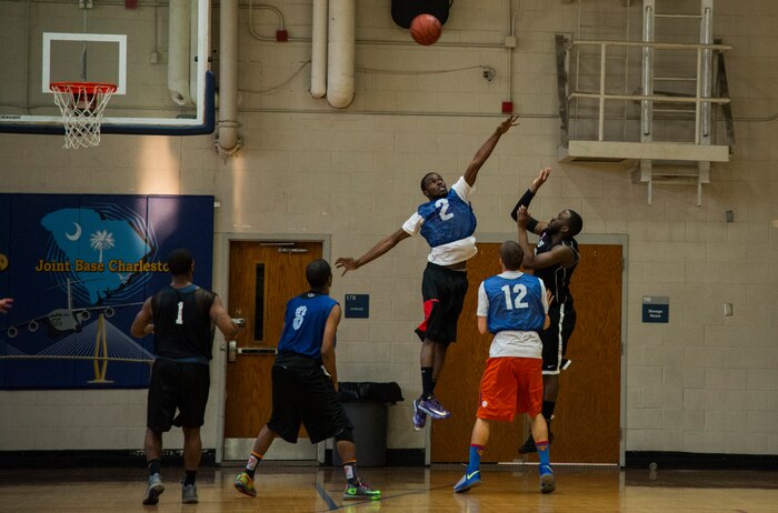 Devon Malone, 628th Security Forces Squadron, shoots a two-pointer during an intramural basketball game Feb. 25, 2014, at the Fitness Center on Joint Base Charleston – Air Base, S.C. Though the 628th SFS team fought hard, the 628th Civil Engineer Squadron took the win, 51 to 37. (U.S. Air Force photo/ Airman 1st Class Clayton Cupit)