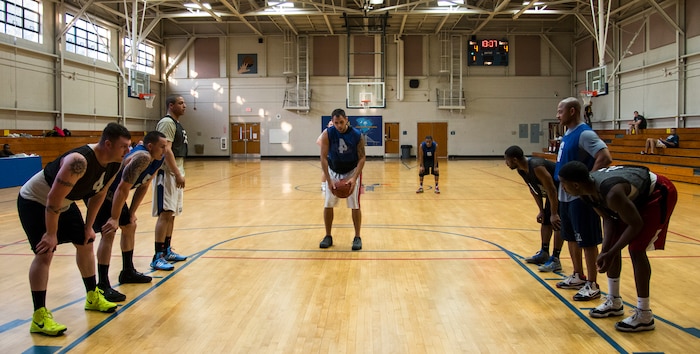 Gerald Jamison, 628th Civil Engineer Squadron, focuses on shooting a free throw during an intramural basketball game Feb. 25, 2014, at the Fitness Center on Joint Base Charleston, S.C. The 628th CES team won 51 to 37. (U.S. Air Force photo/ Airman 1st Class Clayton Cupit)