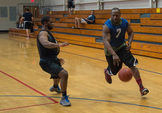 Marcus Shepard, 628th Civil Engineer Squadron, drives from the top of the key during an intramural basketball game Feb. 25, 2014, at the Fitness Center on Joint Base Charleston – Air Base, S.C. The 628th CES team won 51 to 37. (U.S. Air Force photo/ Airman 1st Class Clayton Cupit)