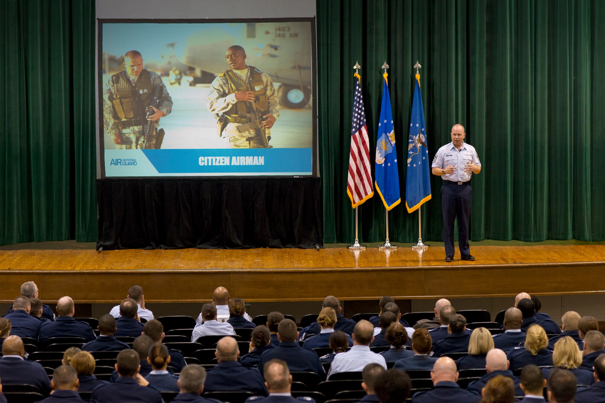 Chief Master Sgt. James W. Hotaling, the command chief of the Air National Guard, addresses airmen during an enlisted town-hall meeting at Joint Base Andrews, Md., Feb. 25, 2014. Hotaling also talked about the National Guard’s 377-year history of performing state and federal missions and three key areas where the ANG excels: protecting the homeland, fighting America’s wars and building global relationships through the State Partnership Program. Hotaling discussed the Command Chief Aim Point document, which addresses an renewed commitment to that profession of arms, health of the force and recognizing the accomplishments of Airmen. (U.S. Air National Guard photo by Master Sgt. Marvin R. Preston/Released)