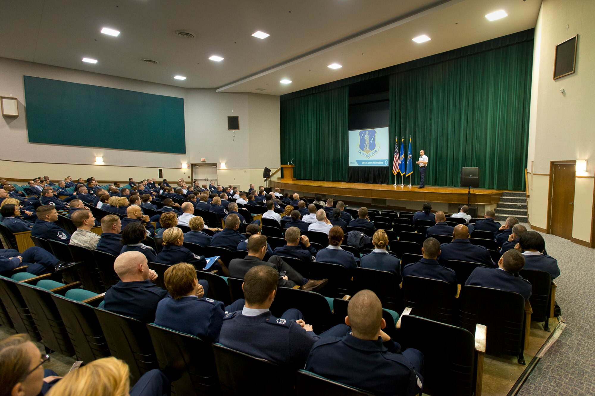 Chief Master Sgt. James W. Hotaling, the command chief of the Air National Guard, addresses airmen during an enlisted town-hall meeting at Joint Base Andrews, Md., Feb. 25, 2014. Hotaling also talked about the National Guard’s 377-year history of performing state and federal missions and three key areas where the ANG excels: protecting the homeland, fighting America’s wars and building global relationships through the State Partnership Program. Hotaling discussed the Command Chief Aim Point document, which addresses an renewed commitment to that profession of arms, health of the force and recognizing the accomplishments of Airmen. (U.S. Air National Guard photo by Master Sgt. Marvin R. Preston/Released)