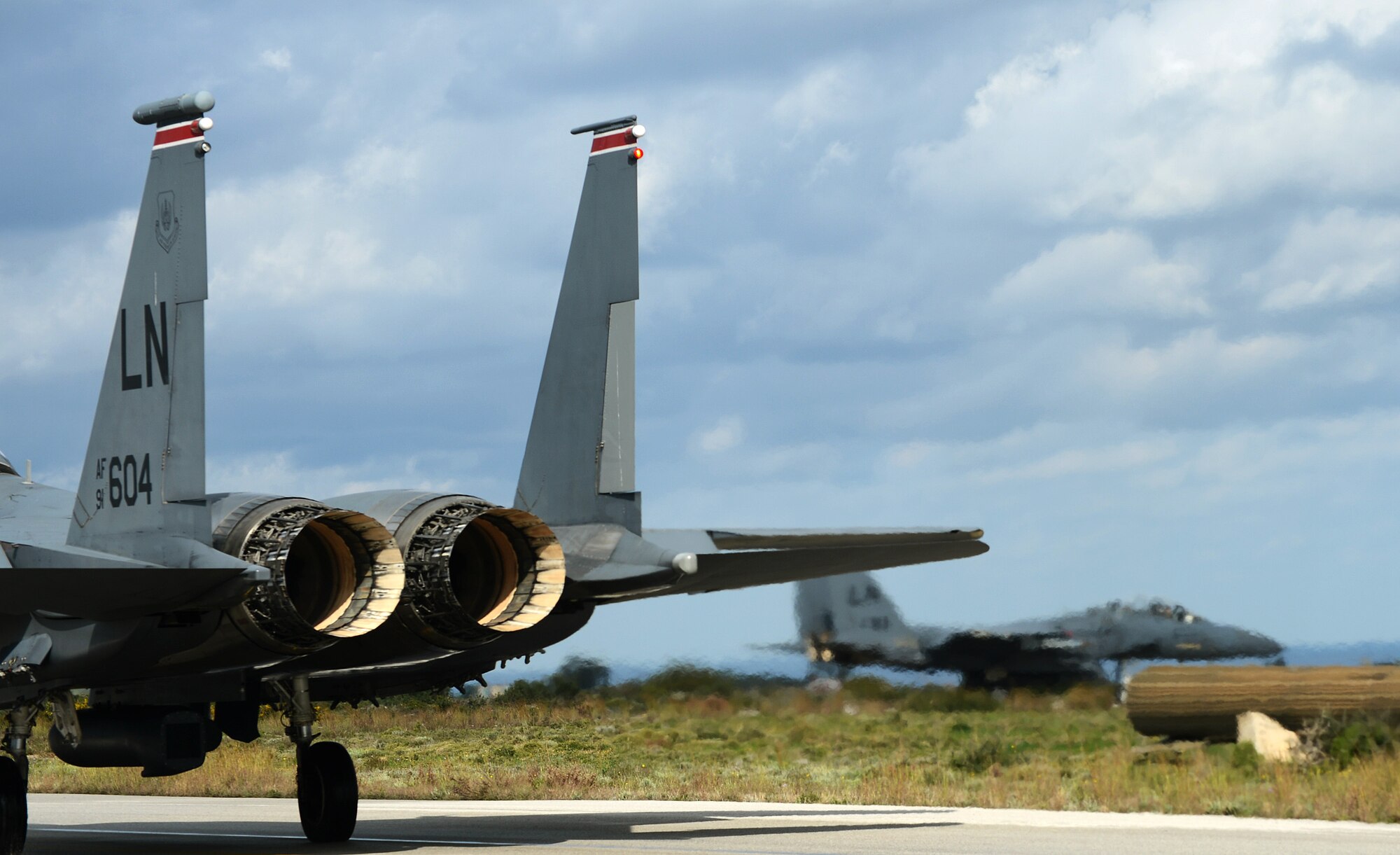 F-15E Strike Eagles of the 494th Expeditionary Fighter Squadron taxi to the Souda Air Base, Greece, runway during a flying training deployment with the Hellenic air force, Feb. 25, 2014. More than 250 Airmen from the 48th Fighter Wing participated in this deployment with NATO partners on Crete to build upon a strong military relationship. (U.S. Air Force photo by Staff Sgt. Thomas Trower/Released)