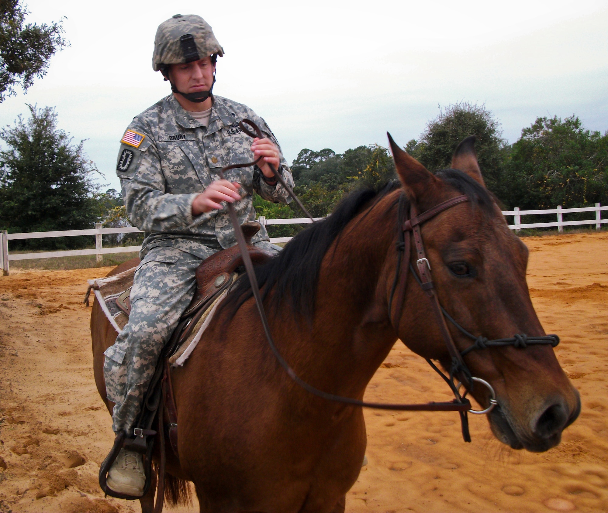 Maj. Nicholas Drury, an explosive ordnance disposal officer, gets used to his ride during a training session in late 2013 at Eglin Air Force Base, Fla.  Eglin’s Sand and Spur Riding Club providing training on how to saddle, pack and ride horses to EOD Army officers as proactive exercise in case they were ever required to do so during a deployment.  (Courtesy photo)