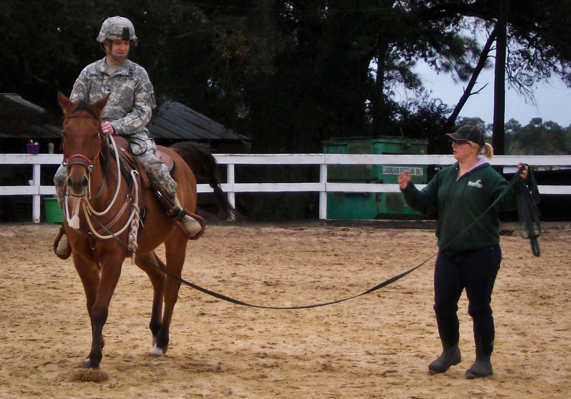 Stephanie Nix instructs a Soldier how to move on horseback during a training session in late 2013 at Eglin Air Force Base, Fla.  Eglin’s Sand and Spur Riding Club providing training on how to saddle, pack and ride horses to explosive ordnance disposal Army officers as proactive exercise in case they were ever required to do so during a deployment.  (Courtesy photo)