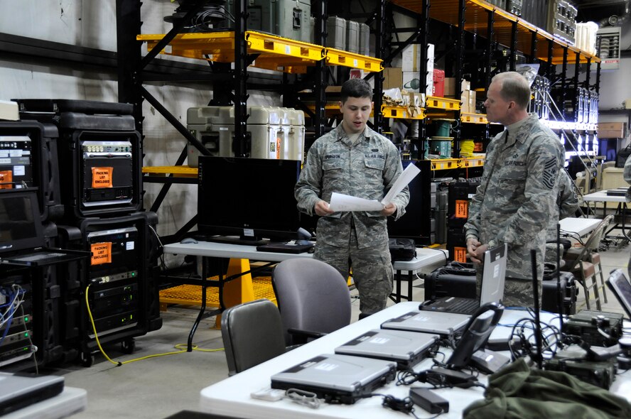 Chief Master Sgt. of the Air Force James Cody, right, talks with Senior Airman Matthew Spurgeon, 271st Combat Communication Squadron cyber transport technician. Chief Cody visited the 193rd Feb. 22-23 to get a firsthand look at the wing’s missions at Middletown, Pa., and Fort Indiantown Gap, Annville, Pa., and to speak with Airmen about challenges they face. (U.S. Air National Guard photo by Tech. Sgt. Culeen Shaffer/Released)