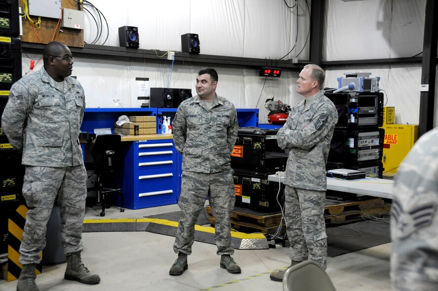 Chief Master Sgt. of the Air Force James Cody, right, talks with Senior Airman Jeremiah, left, 193rd Special Operations Communications Squadron radio frequency transmissions system technician and Tech. Sgt. Jaison Amman, 211th Engineering Installation Squadron electronic engineer. Chief Cody visited the 193rd Feb. 22-23 to get a firsthand look at the wing’s missions at Middletown, Pa., and Fort Indiantown Gap, Annville, Pa., and to speak with Airmen about challenges they face. (U.S. Air National Guard photo by Tech. Sgt. Culeen Shaffer/Released)