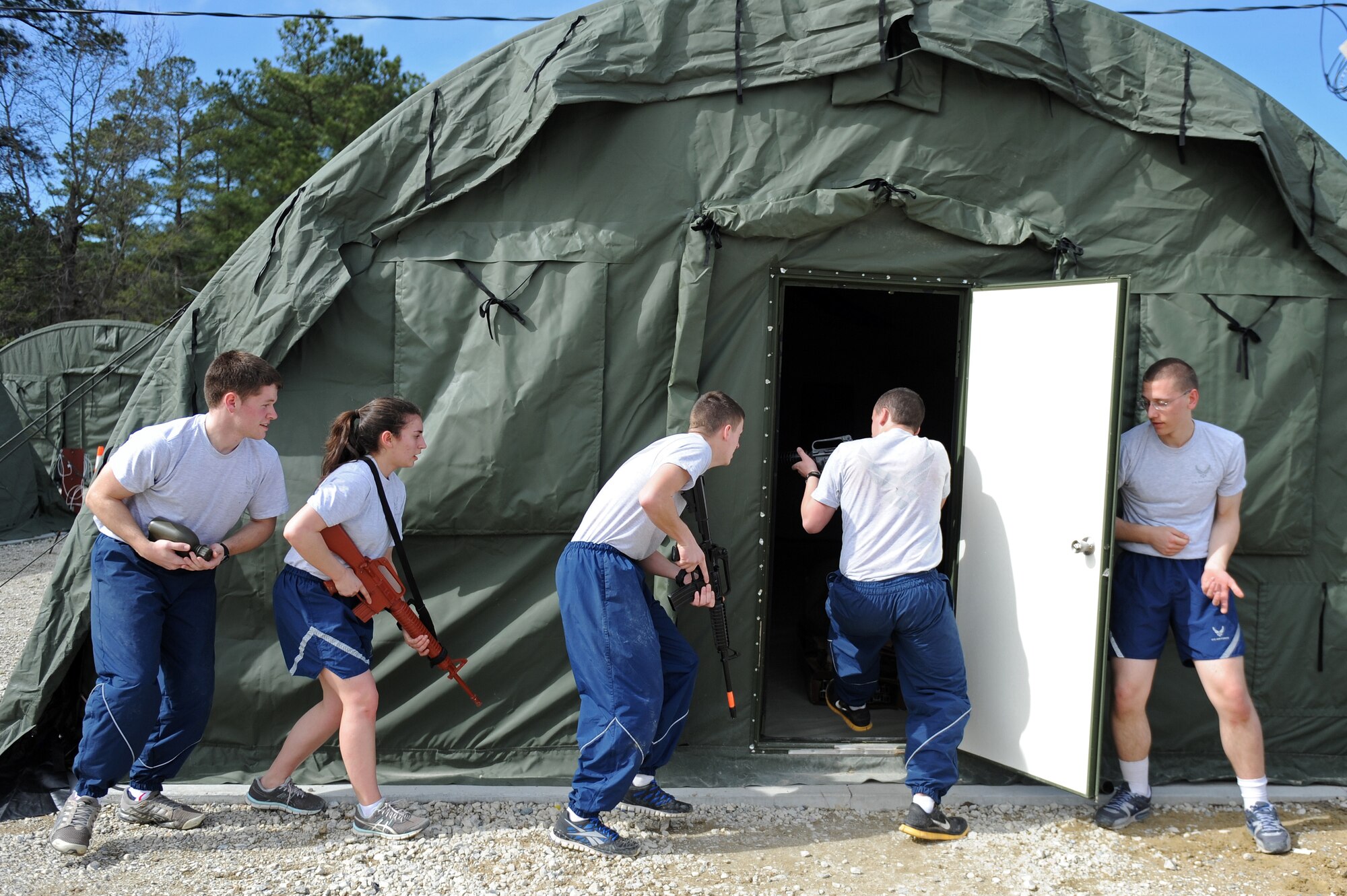 Air Force Reserve Officer Training Corps cadets clear a tent during a Field Training Preparatory Exercise, Feb. 22, 2014, at Seymour Johnson Air Force Base, N.C. During the exercise, cadets defended a mock deployed installation from simulated attacks. (U.S. Air Force photo by Airman 1st Class Aaron J. Jenne)