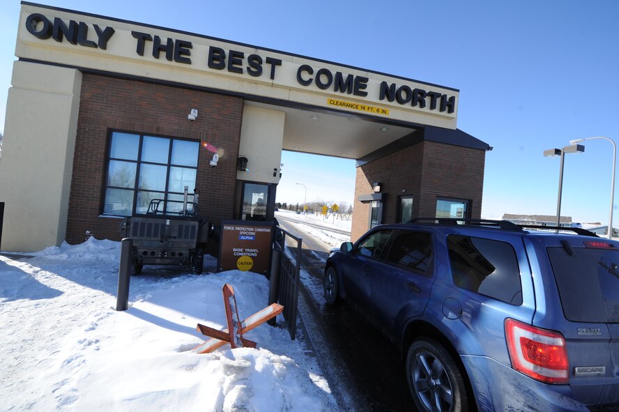 A vehicle enters the Main Gate at Minot Air Force Base, Feb. 19, 2013. Gate traffic tends to get backed up during the morning rush hour, but the 5th Bom Wing Safety Office is currently looking for solutions. (U.S. Air Force photo/Senior Airman Brittany Y. Auld)