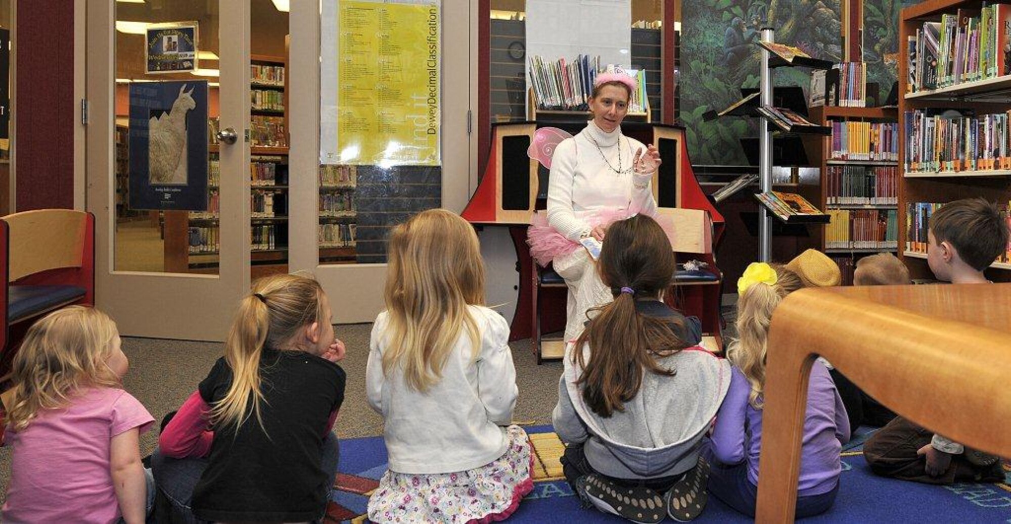 PETERSON AIR FORCE BASE, Colo. -- The 21st Dental Squadron Tooth Fairy visited the Base Library Feb. 19 to read to the children during story time. The children learned the importance of good oral hygiene and each child received a special gift from the Tooth Fairy. (U.S. Air Force photo)