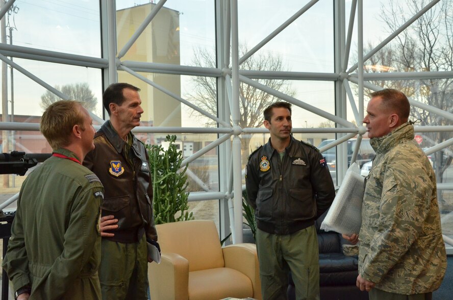 U.S. Air Force Lt. Gen. Stanley E. Clarke III (center left), director of the Air National Guard, talks with members of the Royal New Zealand and Royal Australian Air Forces at the Advance Airlift Tactics Training Center (AATTC) at Rosecrans Air National Guard Base, Mo., Jan. 30, 2014. Clarke visited the base during the AATTC’s annual symposium. (U.S. Air National Guard photo by Tech. Sgt. Erin Hickok/Released)