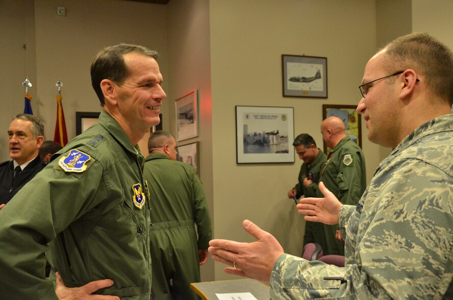 U.S. Air Force Lt. Gen. Stanley E. Clarke III (left), director of the Air National Guard, talks with an Airman from the Advance Airlift Tactics Training Center (AATTC) at Rosecrans Air National Guard Base, Mo., Jan. 30, 2014. Clarke visited the base during the AATTC’s annual symposium. (U.S. Air National Guard photo by Tech. Sgt. Erin Hickok/Released)