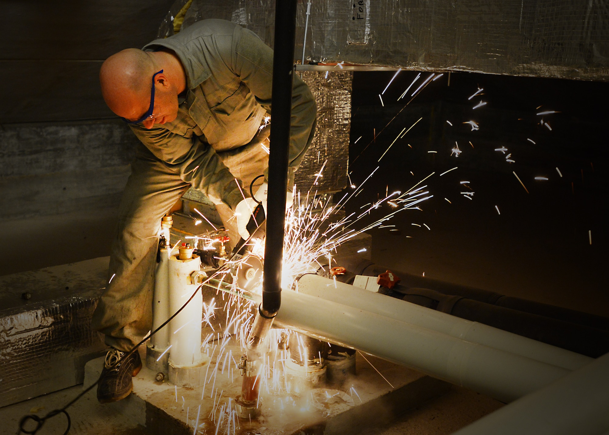 Alfredo Marchiori, 31st Civil Engineer Squadron heating, ventilation, air conditioning and refrigeration technician, cuts a hot water pipe, Feb. 19, 2013, at Aviano Air Base, Italy. HVAC/R technicians maintains the integrity of the hot-water systems, which provide hot water to Aviano work centers throughout the base including dormitories, communication rooms, temporary lodging facility and the Exchange. (U.S. Air Force photo/Airman 1st Class Deana Heitzman) 