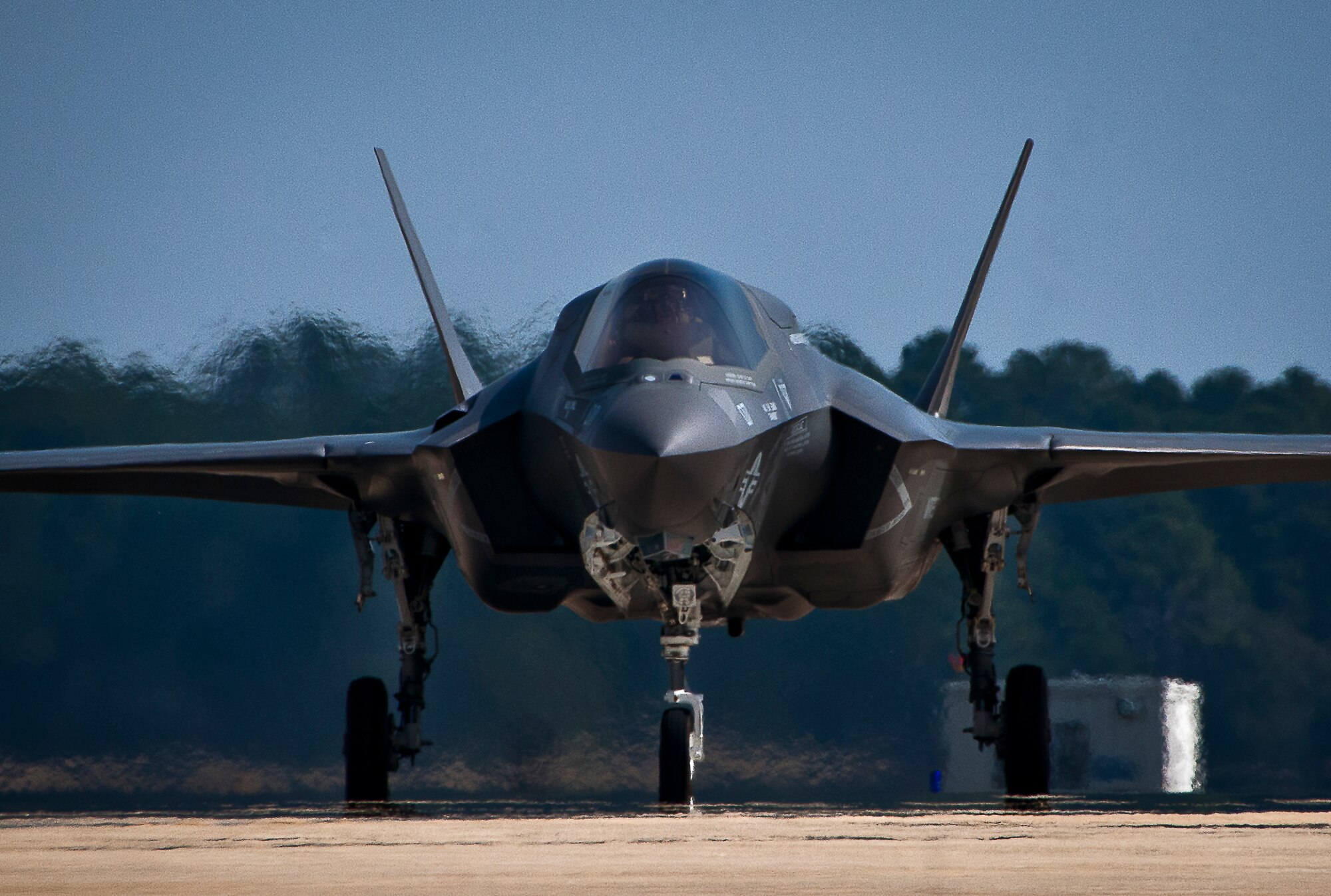 Royal Air Force pilot, Squadron Leader Hugh Nichols, taxies his Marine F-35B Lightning II in after completing the first short take-off and vertical landing sortie by a United Kingdom pilot at Eglin Air Force Base, Fla., Feb. 25.  The U.S. Marines began flying STOVL sorties at Eglin in October 2013.   (U.S. Air Force photo/Samuel King Jr.)