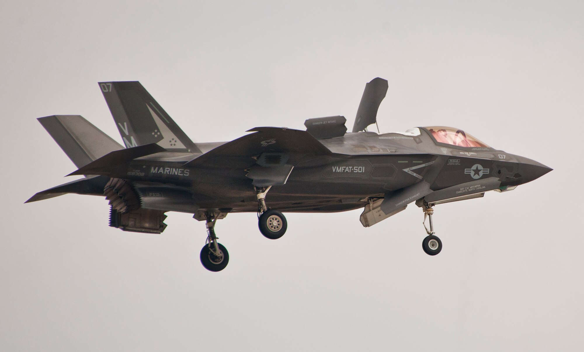 Royal Air Force pilot, Squadron Leader Hugh Nichols, hovers over the runway in a Marine F-35B Lightning II during the first short take-off and vertical landing sortie by a United Kingdom pilot at Eglin Air Force Base, Fla., Feb. 25.  The U.S. Marines began flying STOVL sorties at Eglin in October 2013.  (U.S. Air Force photo/Samuel King Jr.)