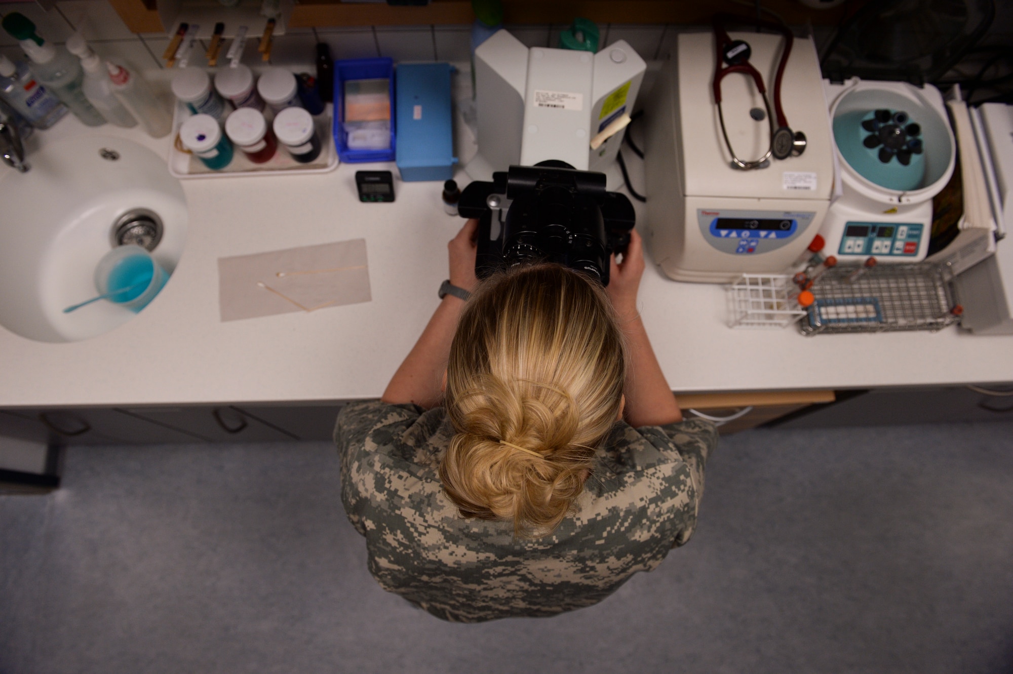 Jenna Giordano, a 52nd Medical Group veterinary technician from Milford, Del., performs lab work Nov. 14, 2013, at Spangdahlem Air Base, Germany. The clinic provides medical treatment to more than 20 animals a day. (U.S. Air Force photo by Senior Airman Rusty Frank/Released)